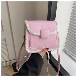 Pink PU leather crossbody bag with white faux fur trim and adjustable shoulder strap detail