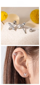 Detailed view of silver flower stud earring with marquise zircon and screw back