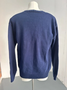 Back view of navy blue crew neck knit sweater with premium ribbed texture details