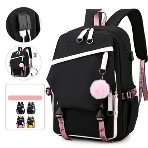 Black student backpack with USB port and plush charm shown in four color variants