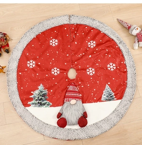 Detail of red Christmas tree skirt with plush gnome and festive snowflake patterns