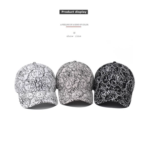 Detailed view of three baseball caps with abstract face line patterns in various colors