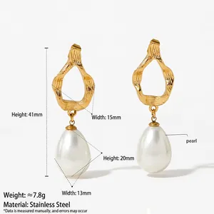 Golden stainless steel long earrings with abstract hollow design and large white drop pearl