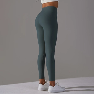Detailed back view of high waisted seamless yoga leggings in dark teal with lift effect