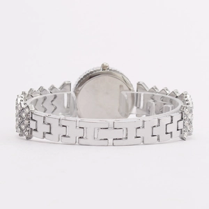 Silver ladies flower quartz watch with rhinestone bracelet shown from the back view