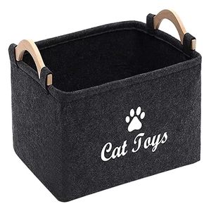 Dark grey felt storage bin with wooden handles for cat toys and household organization