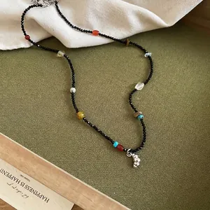 Handmade natural stone beaded necklace with vintage pendant on olive textured base
