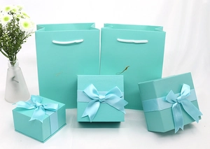 Elegant Tiffany blue jewelry gift box set with silk bows and matching paper bags