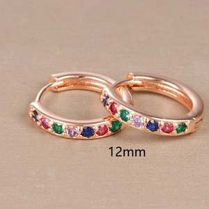 Macro shot of 12mm rose gold hoop earring with colorful paved cubic zirconia stones