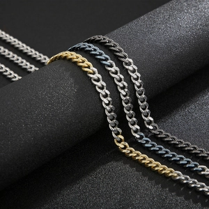 Close-up of mixed-color stainless steel NK chains on industrial display stands