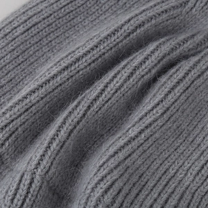 Macro shot of gray ribbed knit texture showing soft wool fibers and warm material