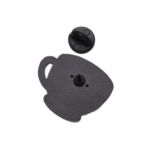 Detail of coffee cup enamel pin back with durable black rubber clutch and matte texture