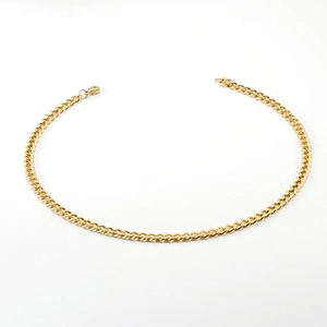 Detail of 18K gold stainless steel Cuban link necklace with secure lobster clasp