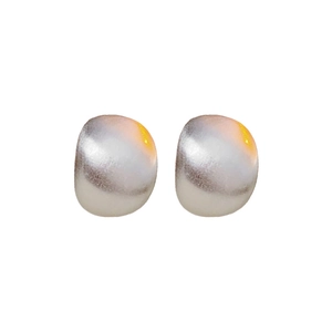 Polished silver dome stud earrings with a minimalist circular design on white background