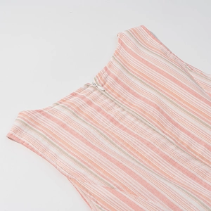 Close-up of pink and white striped fabric with invisible zipper on back dress