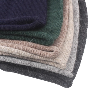 Detail of multi-color ribbed knit beanies showing soft rabbit fur blend texture