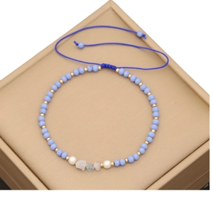 Handmade Bohemian natural stone bead bracelet with blue weaving and golden accents