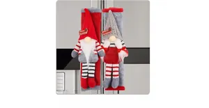 Detail of Christmas gnome refrigerator handle covers in red and grey knitted fabric