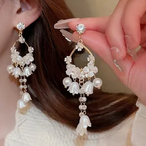 French style lily of the valley tassel earrings with pearls and crystals on model