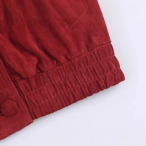 Deep red suede jacket featuring elastic hem and matching fabric buttons detail