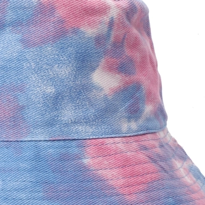 Double-sided tie-dye bucket hat in blue and pink denim fabric for outdoor sun protection