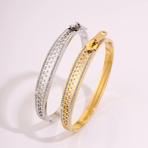 Detailed view of silver and gold zipper bangles with micro-pave diamond embellishments