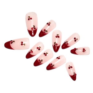Short almond press-on nails with red French tips and 3D cherry patterns for women