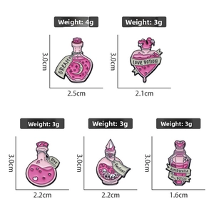 Detail of pink enamel pins featuring magic potion bottles with labels like Dream and Love Potion