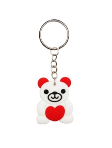 Detail of white PVC bear keychain with red heart and silver metal ring attachment