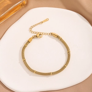 Minimalist gold mesh chain bracelet in stainless steel with cylindrical metal accents