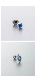 Detail of labret studs with round blue opal and marquise zircon in titanium steel