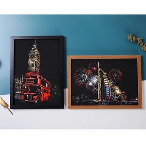 Framed city night view scratch art set featuring London and Dubai landmarks in wood frames