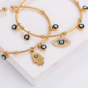 Golden Hamsa Hand and Evil Eye cable bracelet with blue enamel and white zircon stones