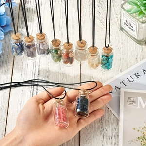 Wish bottle necklace with glass pendant filled with colorful crystals and wax rope