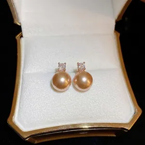 Elegant champagne gold pearl earrings with sparkling zircon stones in a gift box