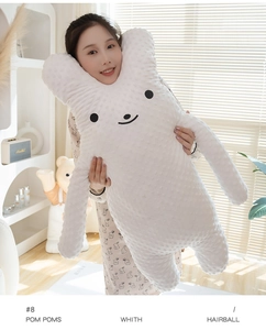 Detail of soft white Minky rabbit plush pillow held by model to show its large size