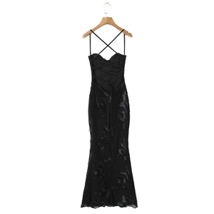 Detail of black mermaid dress featuring intricate 3D floral embroidery and lace texture