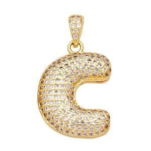 Macro shot of gold-plated letter C pendant with sparkling pavé cubic zirconia