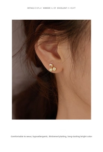 Detailed view of 925 silver cherry earrings with gold plating and zircon stones