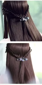 Detail of vintage flower hair clip with deep purple crystals and black alloy base