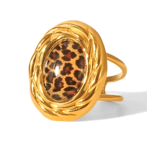 Macro shot of gold stainless steel ring with vintage oval leopard print inlay details