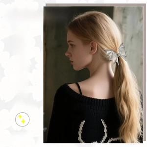 Detail of silver metal bat wing hair claw clip with gothic Halloween style on hair