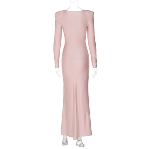 Close-up detail of the pink evening gown featuring stretch fabric and sleek floor-length hem