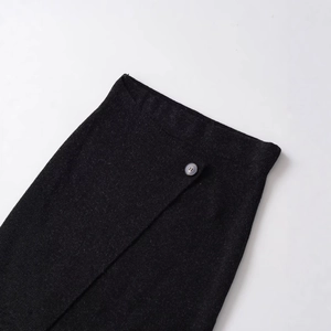 Women's dark grey knitted wrap midi skirt featuring an asymmetrical hem and side button