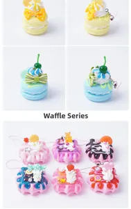 Macro shot of realistic PVC waffle keychain charms with colorful cream and fruit details