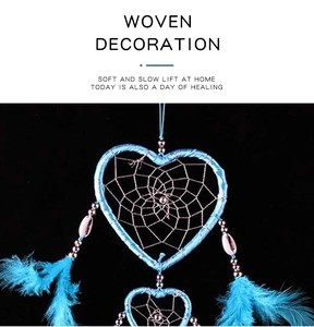 Blue double heart-shaped dream catcher with soft hanging feathers and beads detail