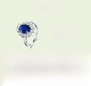 Detailed product specs of S925 silver ring featuring 7x9mm oval blue gemstone