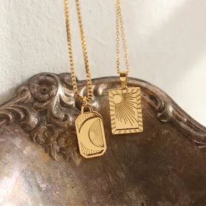 18K gold plated sun and moon rectangle pendant necklace with celestial radial patterns