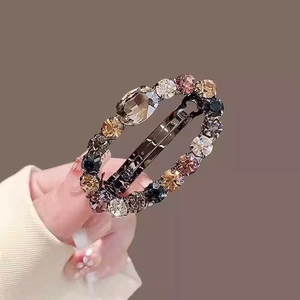 Elegant vintage crystal flower hair claw clip with champagne and amber rhinestones