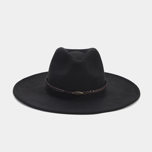 Detail of black wool fedora hat featuring a brown braided leather band and metal buckle